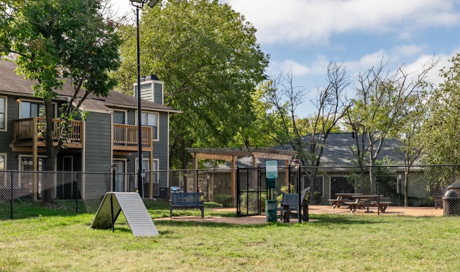 Fenced in dog park with agility course
